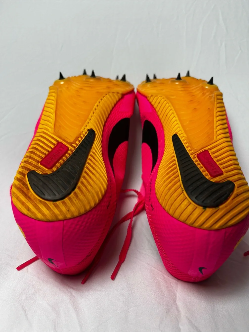 Nike Bright Pink Athletic track with Black Swoosh men’s 10/1/2